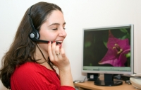 Girl with Flowers On Computer